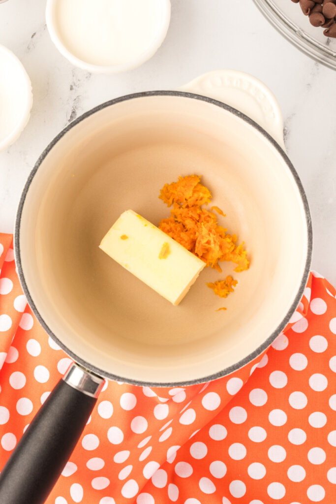 butter and orange zest in saucepan