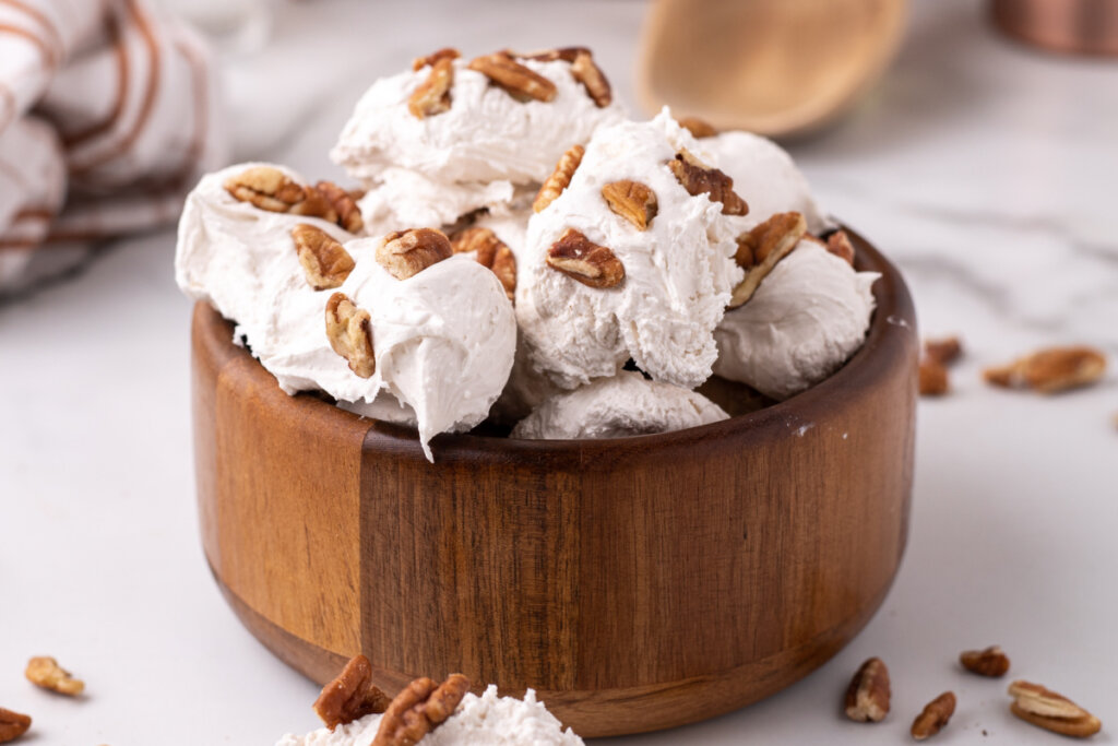 closeup of wooden bowl with divinity candy