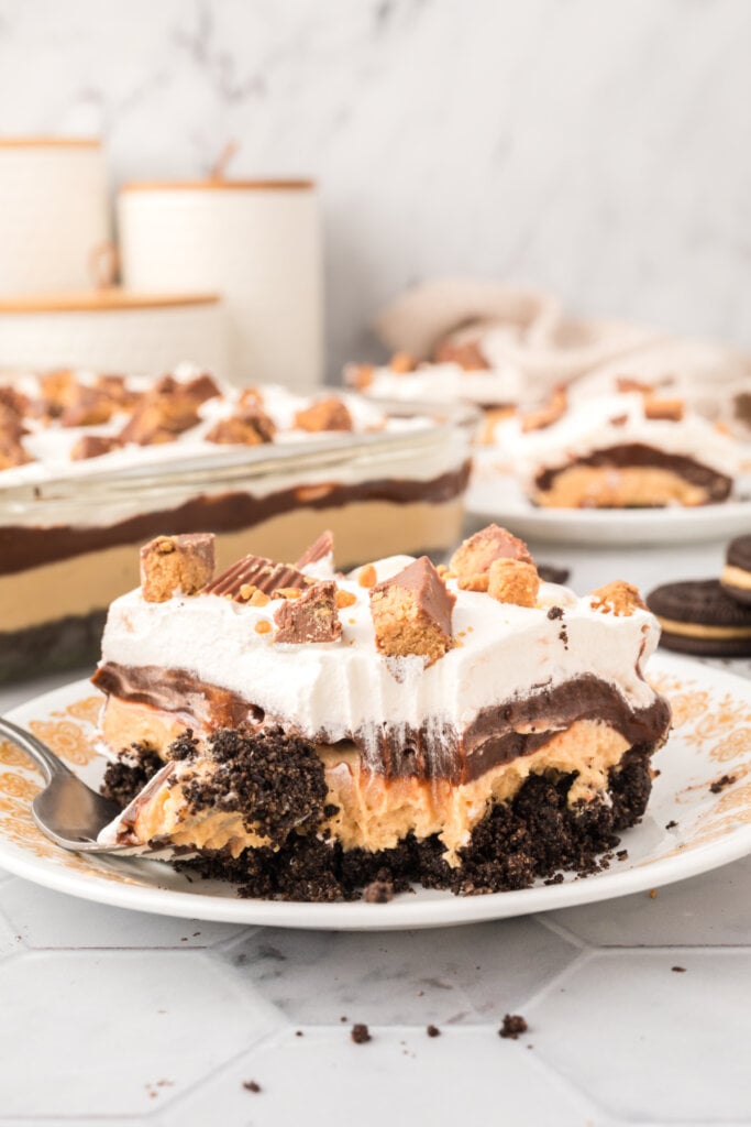 slice of peanut butter cup lasagna lush on plate