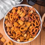 slow cooker chex mix in white bowl