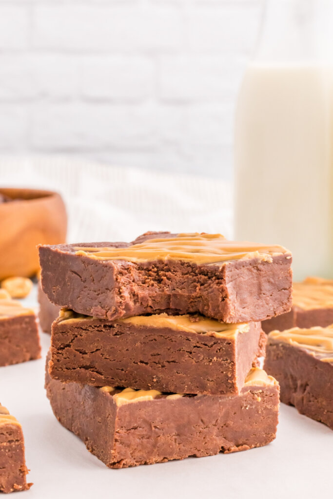 three pieces of chocolate peanut butter fudge stacked