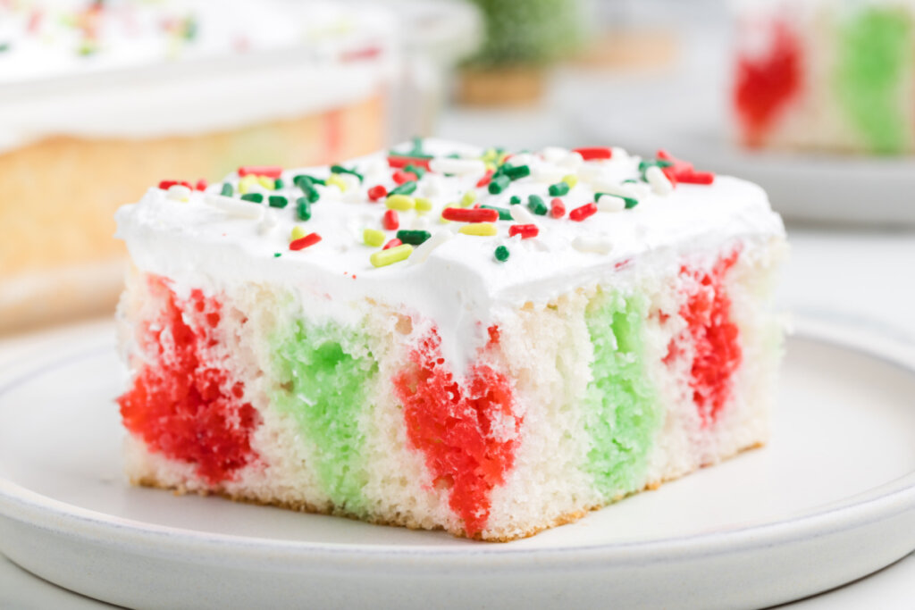 slice of christmas poke cake on plate