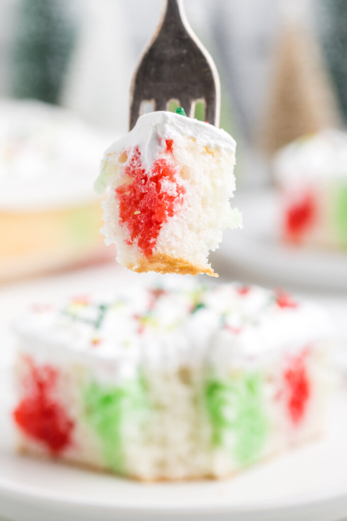 bite of christmas poke cake on fork