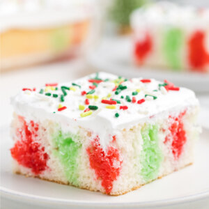 slice of christmas poke cake on plate