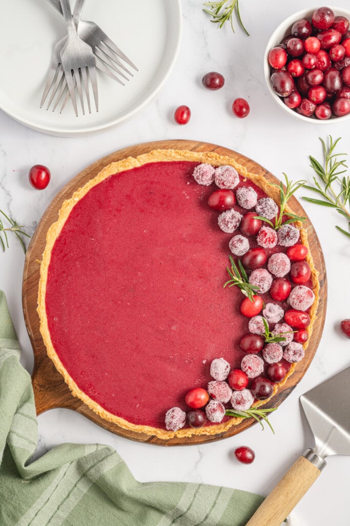 looking down onto a whole unsliced cranberry curd tart