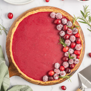 looking down onto a whole unsliced cranberry curd tart