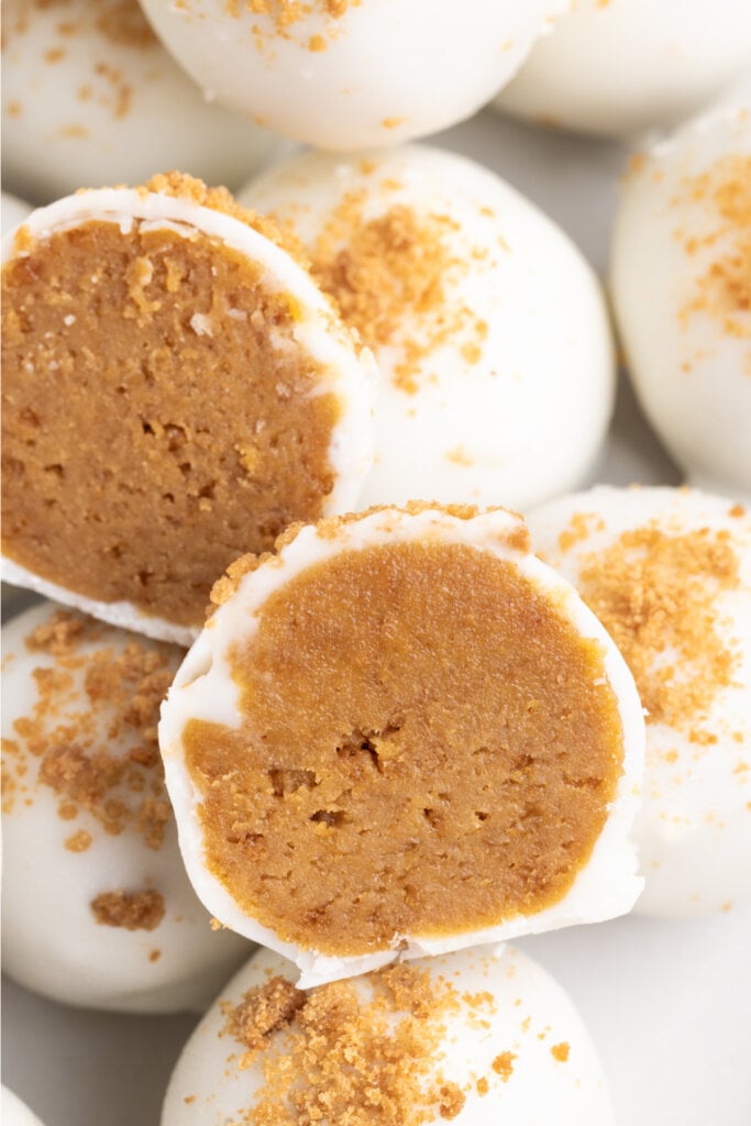 closeup of a gingerbread truffle cut in half to show the texture of the inside