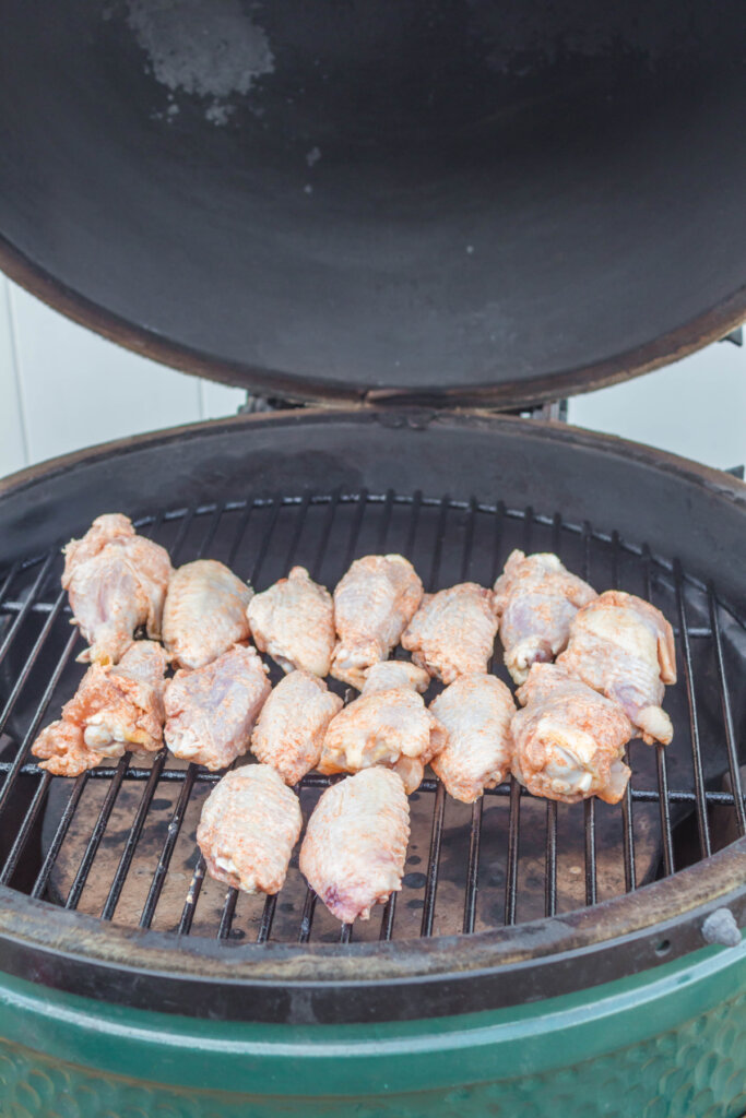 raw chicken wings on grill