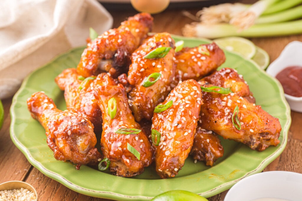 cooked honey sriracha wings on green plate
