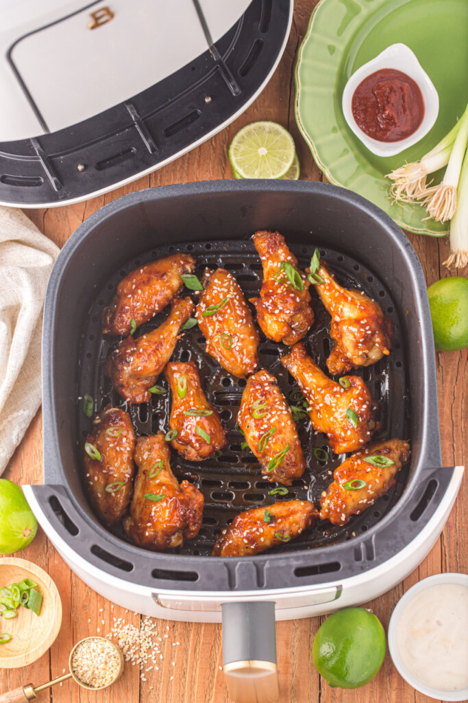 honey sriracha wings in air fryer basket