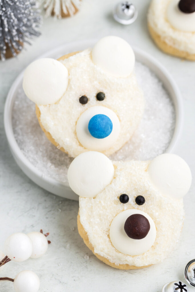 two polar bear face cookies on plate