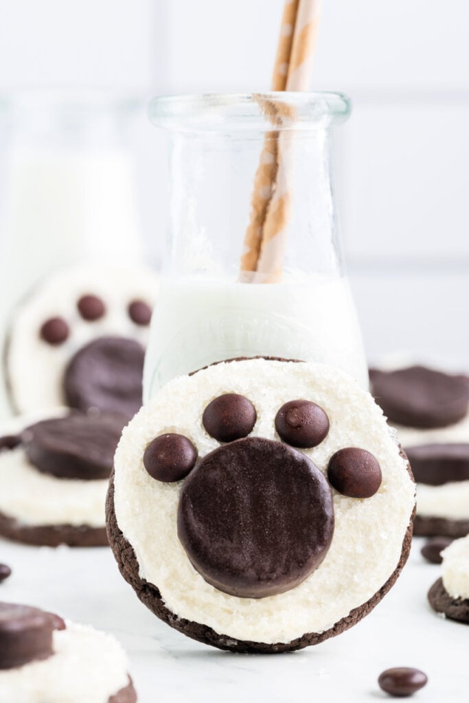 polar bear paw cookie next to milk glass