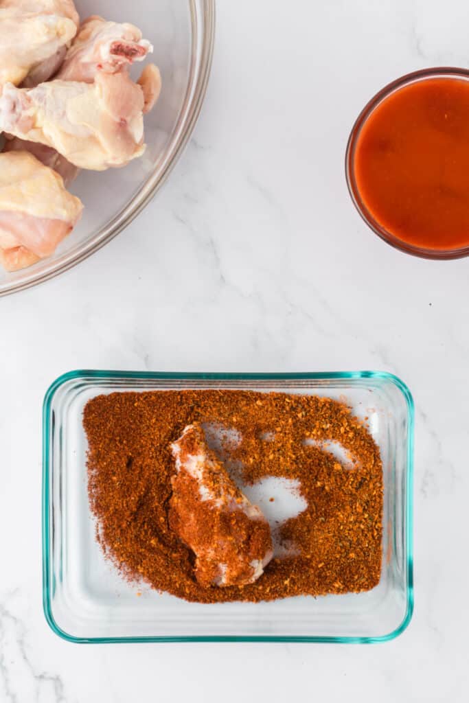 coating chicken wings in seasoning