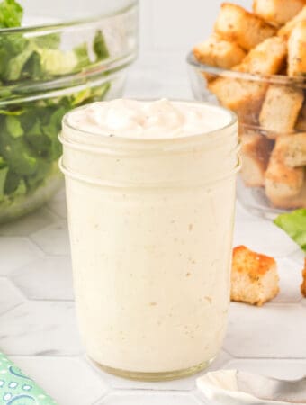 homemade caesar salad dressing in glass jar