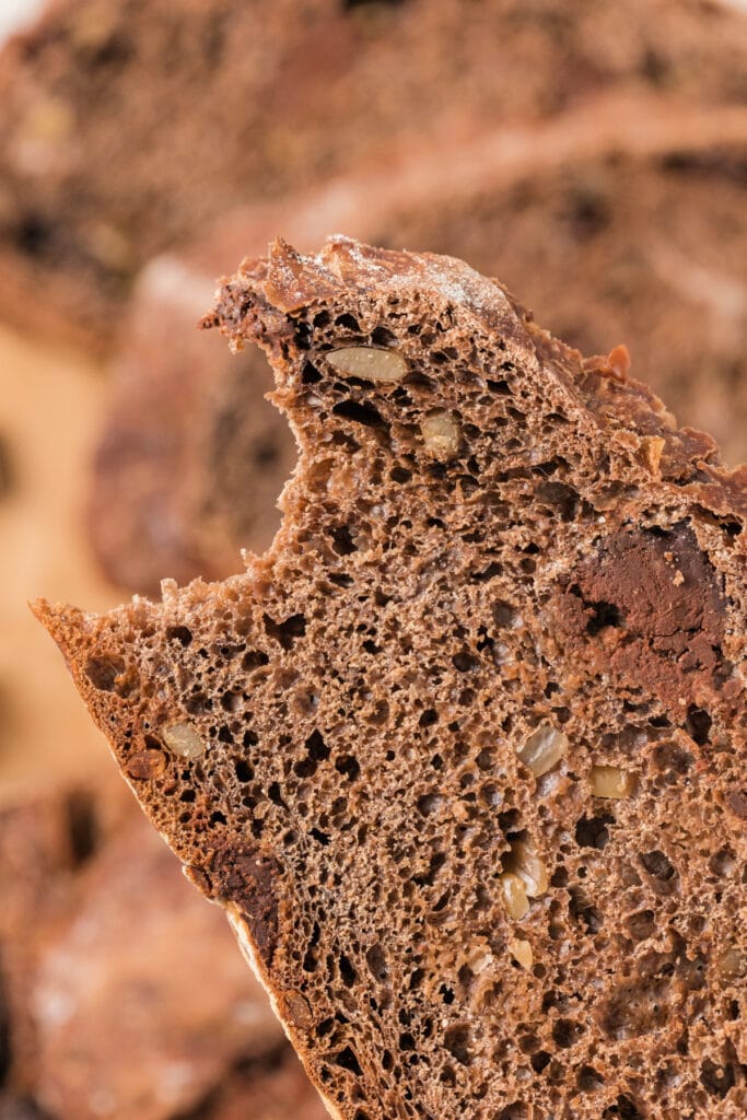 closeup of a slice of bread with a bite taken out