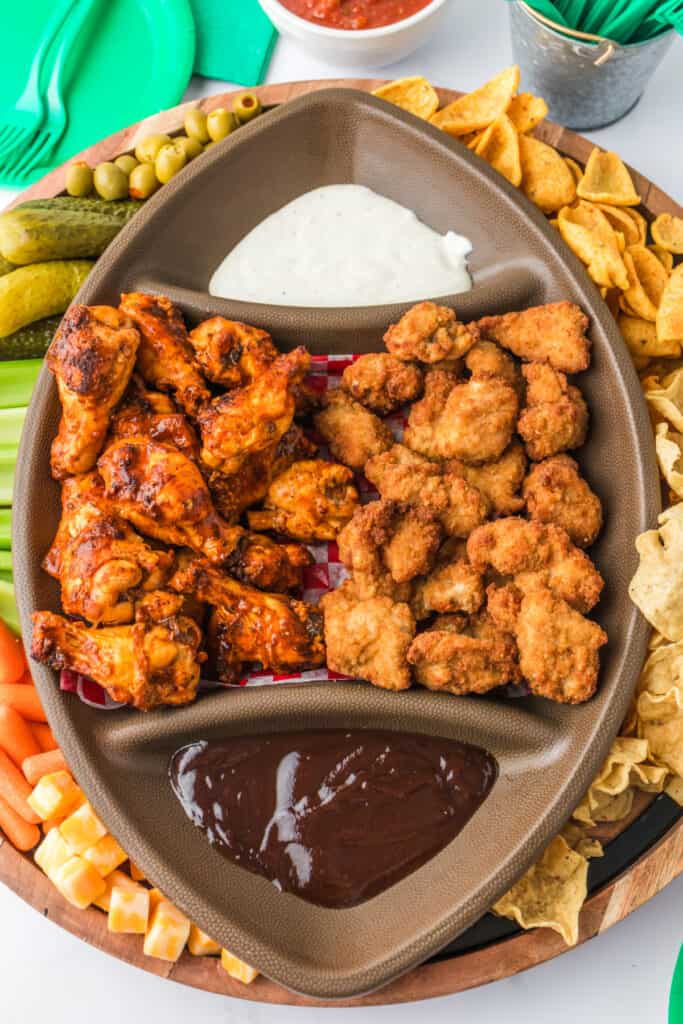 closeup of game day snacks in football charcuterie board