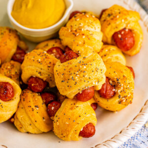 closeup of pigs in a blanket on plate