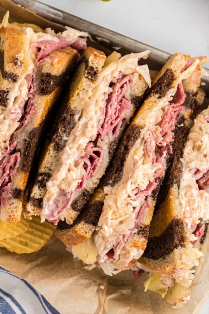 looking down on halves of a reuben sandwich in a container