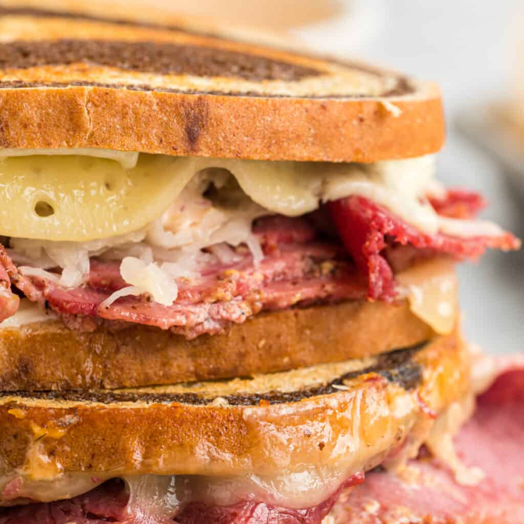 closeup of reuben sandwiches