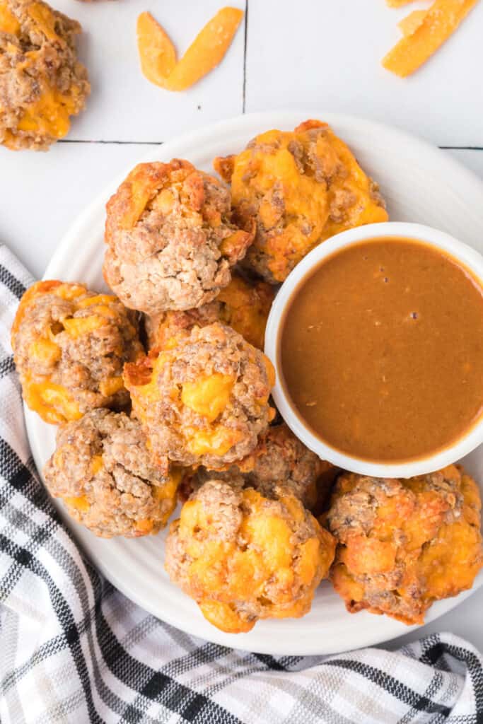 plate with sausage balls and dipping sauce