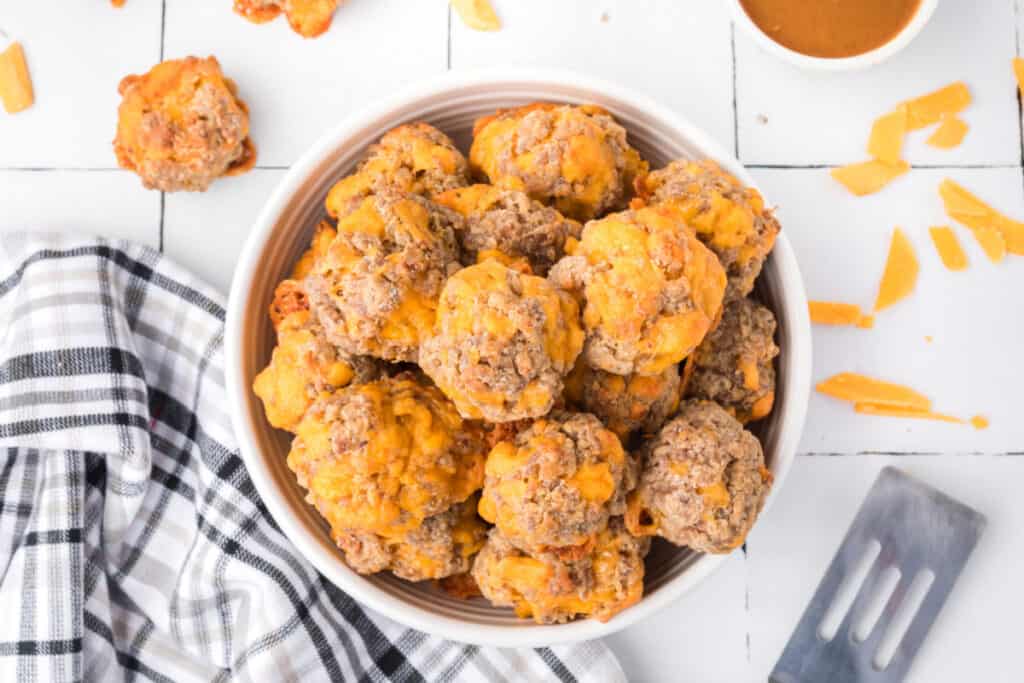 looking down onto a bowl filled with sausage balls