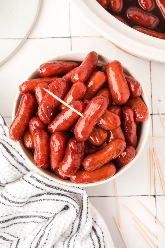 looking down into a bowl filled with bbq little smokies