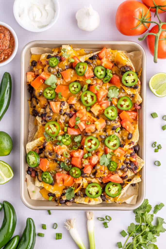 sheet pan filled with spicy loaded black bean nachos