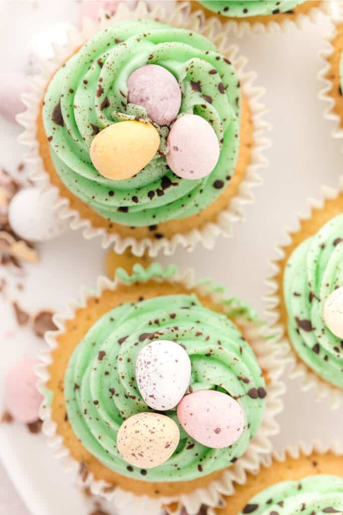 looking down on two cupcakes topped with swiss meringue buttercream
