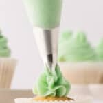 closeup of swiss meringue buttercream being piped