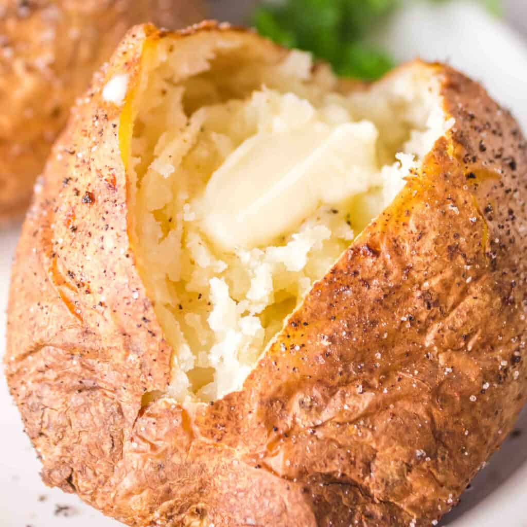 closeup of a baked potato with butter