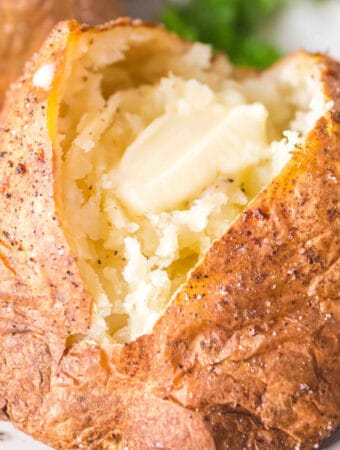 closeup of a baked potato with butter