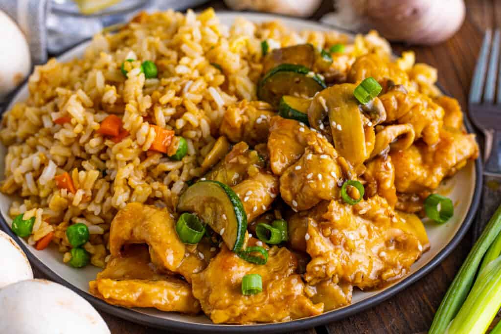mushroom chicken recipe on plate with fried rice