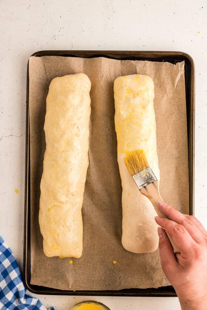 Place seam side down on baking sheet. Brush rolled loaves with beaten egg ...