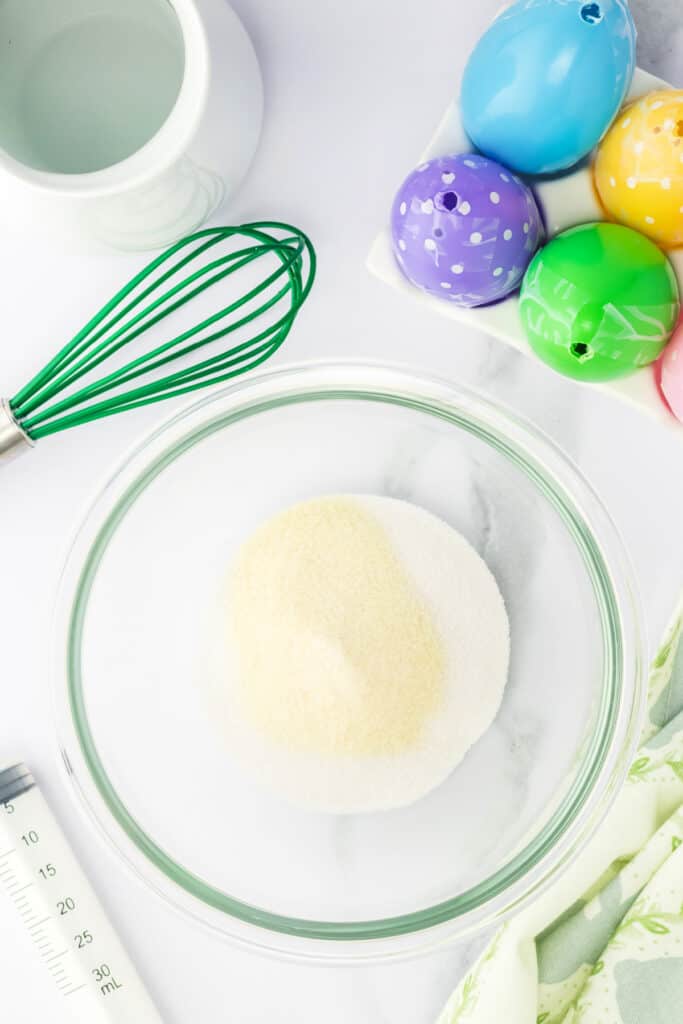 In a small bowl, stir the contents of the jello package and the gelatin. 