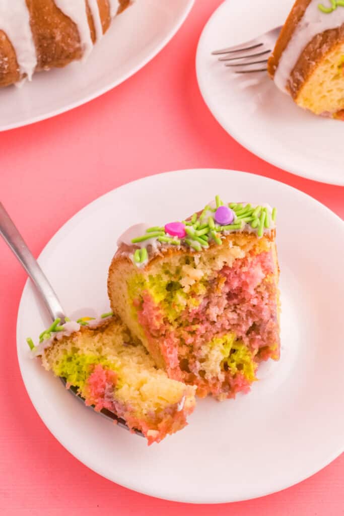 slice of easter swirl bundt cake on plate with bite on fork