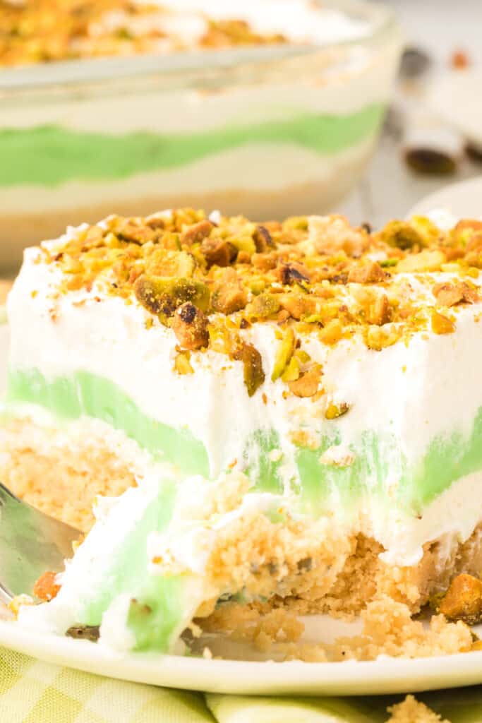 closeup to show the texture and creaminess of the layered pistachio dessert