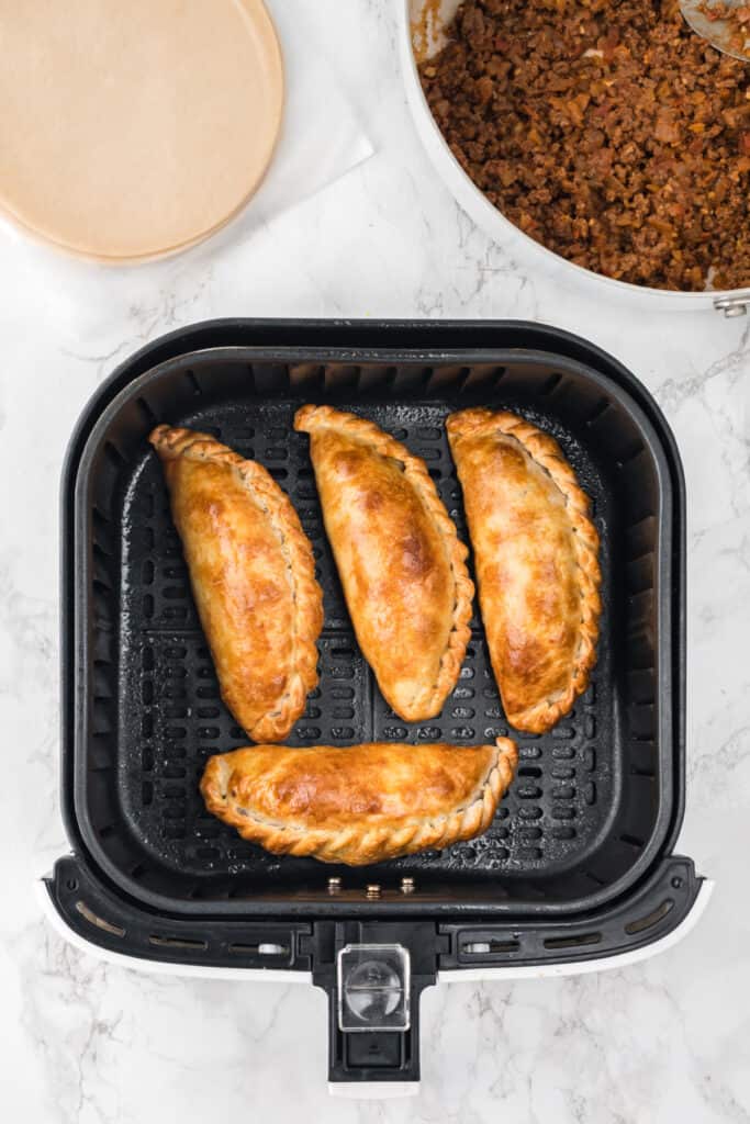 Cook for 10-12 minutes, or until the empanadas are golden brown and crispy.