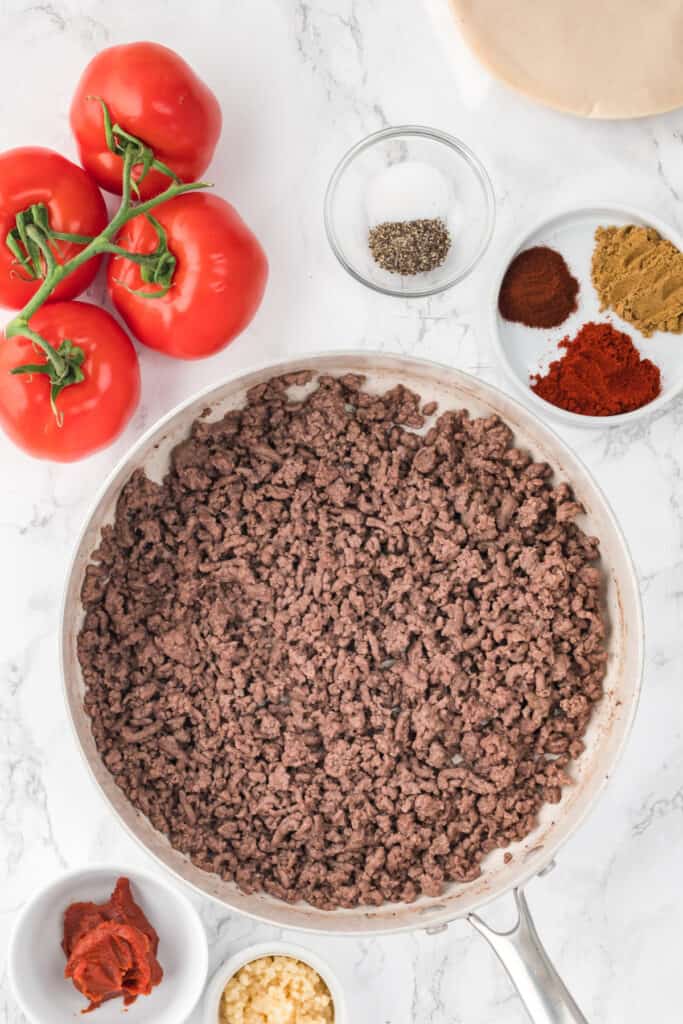 In a skillet over medium-high heat, cook ground beef until browned and cooked through about 8-10 minutes. Drain any excess fat.