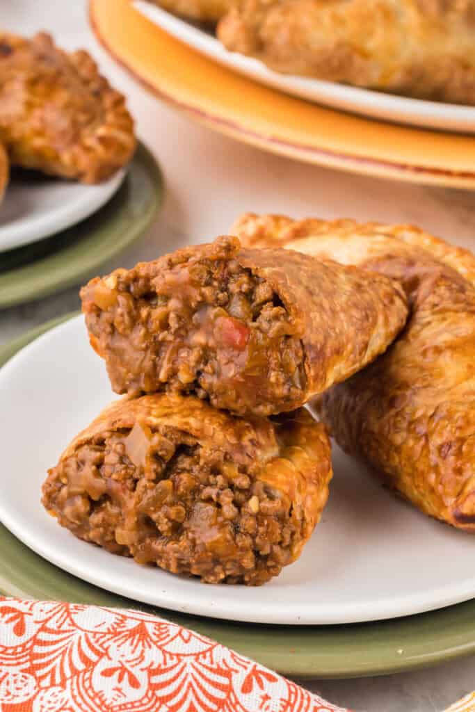 beef empanada in half on plate