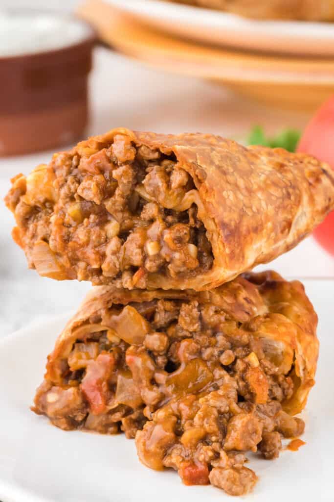 air fryer beef empanada split in half to show the inside