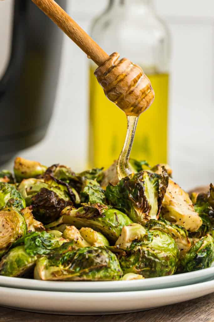 drizzling honey over roasted brussels sprouts