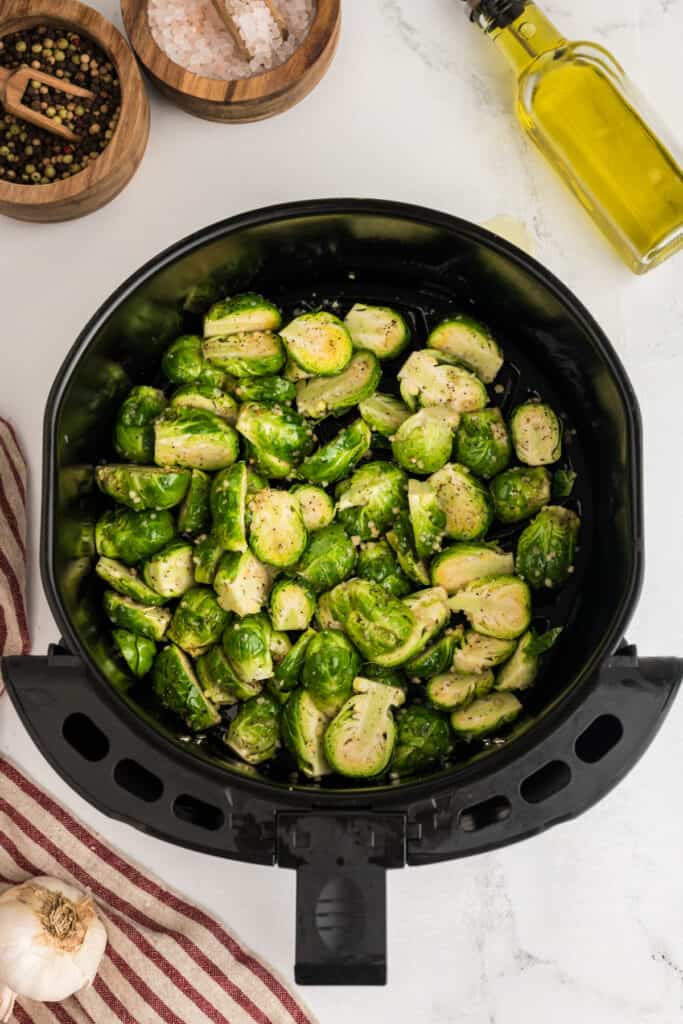 Preheat the air fryer to 385℉ and spray the air fryer basket with non-stick cooking spray. Add the Brussels sprouts to the air fryer basket and cook for 10 minutes. After 5 minutes, shake the Brussels sprouts around in the basket to ensure even cooking and cook for the remaining 5 minutes. 
