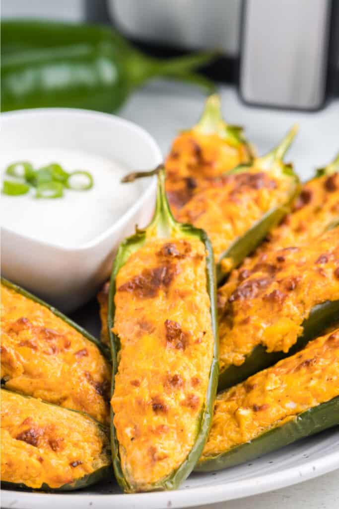 air fryer buffalo chicken jalapeno poppers on plate to serve