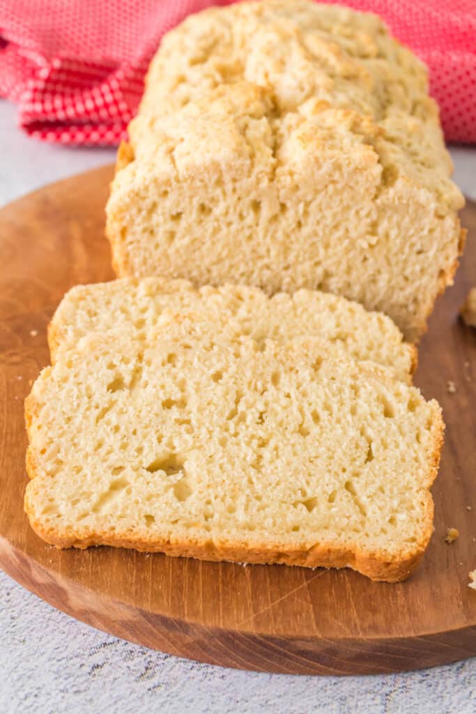 closeup of a loaf and slice of beer bread