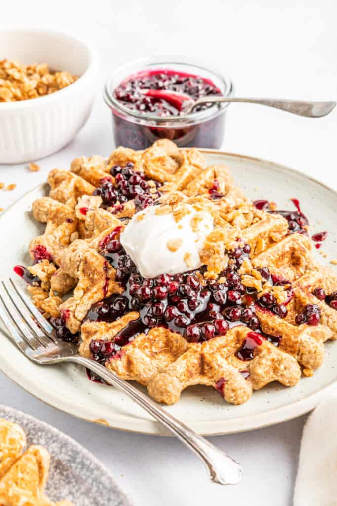 waffles with blueberry sauce on plate