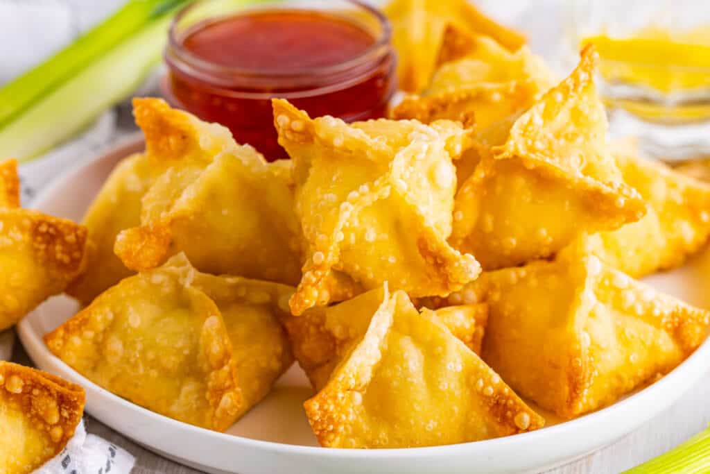 crab rangoon on plate with sweet chili sauce