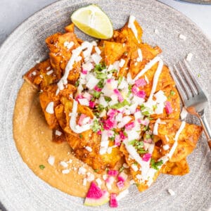 mole chilaquiles on gray plate