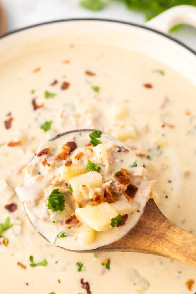 spoon ladling chowder from the pot