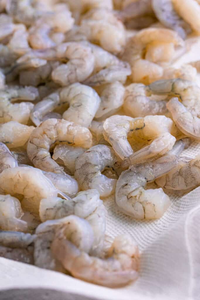 Heat peanut oil in a deep fryer or Dutch oven to 350°F. Dry the shrimp with paper towels.