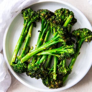roasted broccolini on white plate